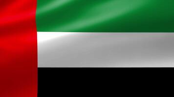 United Arab Emirates flag in close up moves in waves in the wind with reflecting light on the smooth silky surface. video