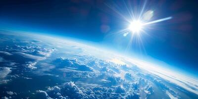 Stunning view of Earths curvature with bright sunlight illuminating clouds and the deep blue atmosphere photo