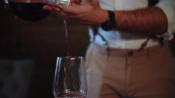 Decanting red wine into a glass video