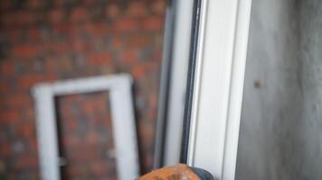 Installing rubber gasket on a window frame video