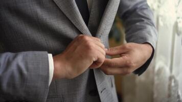 Man button buttons on elegant jacket video