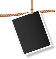 Blank instant photo with white frame hanging on brown rope with wooden clothespin, isolated on white background, creating vintage memories concept vector