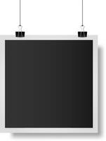 Realistic illustration of a blank photo frame hanging on two black clips with strings. Isolated on a white background. Providing a simple yet elegant template for showcasing images or memories vector
