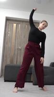 A captivating performance in a minimalist setting. The dancer tells a story through controlled, flowing movements, evoking both power and vulnerability. video