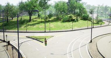 Roundabout with green vegetation in a quiet urban setting during daylight video