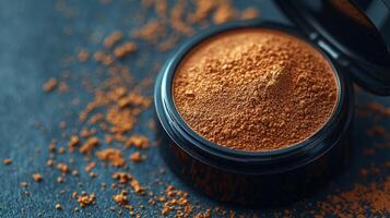 Close up captures deep brown face powder matte finish in its case. Lighting emphasizes soft texture and rich pigment complemented details of compact lid photo