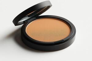 close up view of neutral medium toned face powder contained in compact built in mirror photo