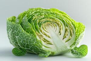 Detailed close up of sliced Brussels sprout showcases its complex inner structure and fresh green tones highlighted clean white backdrop for modern aesthetic photo