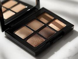 palette featuring matte eyeshadows in warm tones such as terracotta and deep brown is elegantly showcased against simple white backdrop emphasizing its soft texture and refined design photo