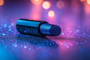 stunning cobalt blue lipstick bullet lies horizontally its satin sheen highlighted bright lighting creating eye catching contrast against clean white surface photo