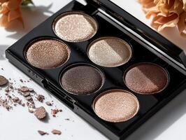 beautifully arranged palette features six matte eyeshadows in warm colors like terracotta beige and deep brown. Soft lighting highlights rich texture and sleek design photo