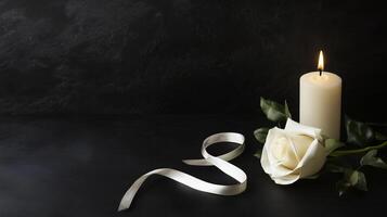 Funeral-themed photo display composition featuring ribbon, white rose