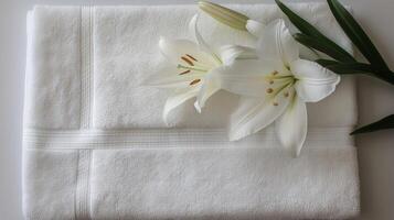 White Lilies Enhance Spa Towels Relaxation and Wellness Concept photo