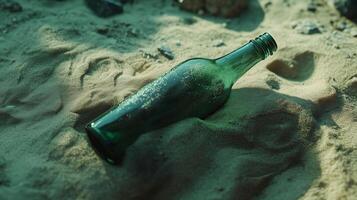 Glass Bottle Partially Submerged in Sand photo