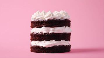 A stack of three chocolate cake layers on a pink background photo