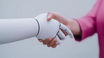 Human and Android Handshake, Symbolizing Modern Technology Integration, Collaboration, Innovation, Artificial Intelligence, Futuristic Business, Digital Partnership, and Advanced Robotics photo