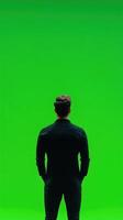 Professional Speaker in Front of Vibrant Green Screen for Dynamic Presentations and Creative Digital Background Concepts in Modern Media and Communication Spaces photo