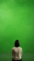 Green Screen Cinema Experience with Back View of Person in White Shirt Highlighting Movie Pre Roll Concept for Interactive Entertainment photo
