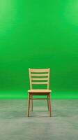 Wooden Chair on Green Screen Background in a Film Studio Setting for Creative Projects and Digital Productions photo