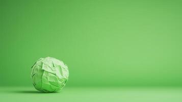 Stop Motion Paper Ball Unwrapping on Green Background, Creative Design Concept, Minimalist Style, Art and Craft, Green Aesthetic, Focus on Innovation and Simplicity, Modern Design Ideas photo