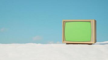 Vintage Television with Green Screen on Snow against Clear Blue Sky, Broadcasting Concept in Retro Style for Nostalgic Winter Theme Images in Stock Photography photo