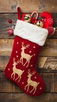 Red Christmas stocking with festive items on rustic wood, enhancing holiday charm Vertical Mobile Wallpaper photo