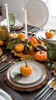 Autumn table setting with pumpkins, gold cutlery, and green glassware, creating harmony Vertical Mobile Wallpaper photo