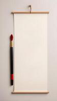 A Chinese calligraphy brush with red ink, prepared for writing festive messages, set against a soft neutral background with room for more text. photo