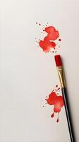 A Chinese calligraphy brush filled with red ink, placed on a light, neutral-colored background with plenty of room for text. photo