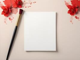 A calligraphy brush with red ink poised for use against a light, neutral backdrop, with ample space for festive greetings. photo