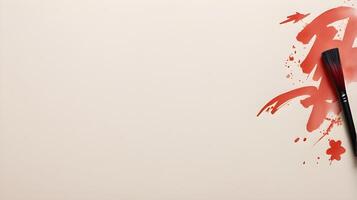 A Chinese calligraphy brush with red ink stands ready to write festive wishes, placed against a light, neutral background with room for additional text. photo