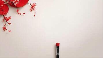 A red ink Chinese calligraphy brush, waiting to inscribe festive wishes, placed against a soft, neutral backdrop with space for text. photo