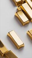 A solitary gold ingot lies on a smooth white paper backdrop, with a soft shadow below and space available for text. photo