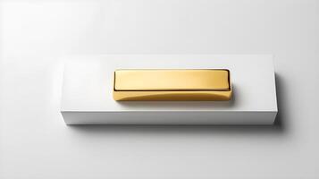 A single gold ingot placed on a plain, smooth white paper background with a soft shadow beneath it, allowing space for text. photo