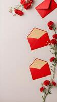 A collection of red envelopes decorated with tiny flowers on a neutral backdrop, with plenty of space to add text or branding. photo