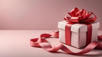The beautifully wrapped gift box with a satin ribbon, placed on soft fabric, is illuminated by warm tones and lighting, creating the perfect space for a loving message. photo