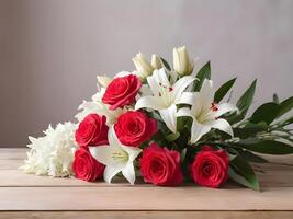 Red roses, white lilies, and pink carnations are elegantly placed on a wooden table, the soft lighting and delicate shadows enhancing the romantic ambiance, leaving room for a message. photo