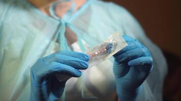 Doctor hands in gloves filling syringe with injection liquid , Vaccine video