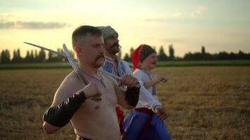 Group of Cossack men in traditional clothes swinging and spinning sharp shashkas 04 video
