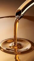 Golden liquid pouring from spout across glossy surface, transitioning in warm shades Vertical Mobile Wallpaper photo