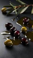 Glossy dark olives scattered on textured surface, reflecting a sophisticated visual Vertical Mobile Wallpaper photo
