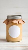 Glass Jar with Yellow Preserve Rustic glass jar with yellow preserve on simple white surface Vertical Mobile Wallpaper photo