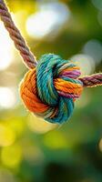 Intricate Colorful Rope Knot in Nature's Embrace photo