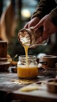 Golden Honey Pouring into a Jar - A Culinary Masterpiece photo