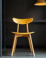 Yellow wooden chair against dark background photo
