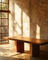 Sunlit Minimalist Interior Design A Rustic Wooden Table Bathed in Warm Golden Light Against a Textured Wall photo