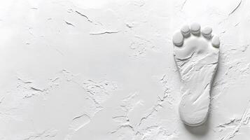 Single footprint impression stands out with subtle texture and soft shadows, creating plaster cast effect against white backdrop in minimalist design. outline photo