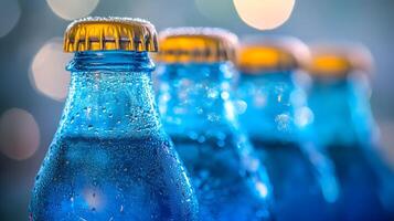 Blue glass soda bottles line up perfectly, displaying carbonated beverages with condensation drops, creating refreshing summer vibes against soft bokeh background. colorful photo