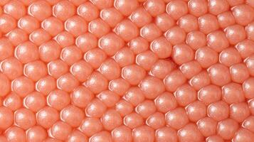 Abstract Background of Close Up Shiny Peach Colored Spheres in a Hexagonal Pattern photo