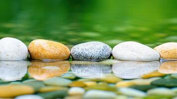 Serene Stones in Still Water Tranquil Nature Scene with Colorful Pebbles and Reflections photo